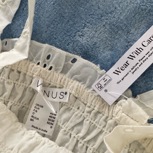 Here’s a polished version of your VENUS Cream Smocked Tie Front Sundress NWT - Picture 3 of 4